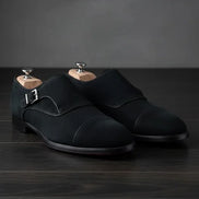 black suede shoes with a buckle