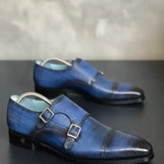 Navy Blue dress shoes with a metallic buckle