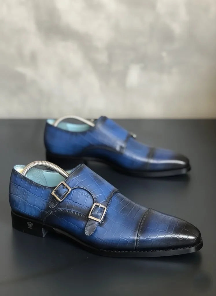 Navy Blue dress shoes with a metallic buckle