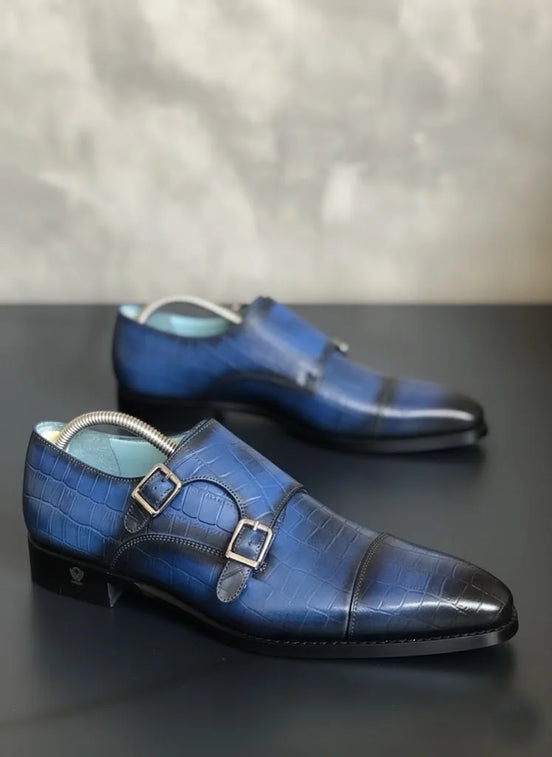 Navy Blue dress shoes with a metallic buckle