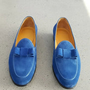 Blue loafers with bow details
