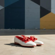 White shoes with red tassels