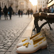 White shoes with yellow tassels