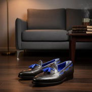 Black loafers with blue accents