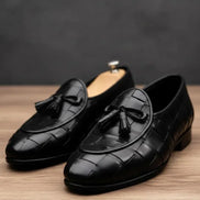 Black loafers with tassels