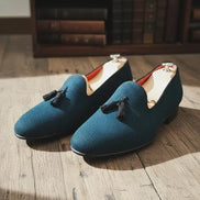 Blue loafers with tassels