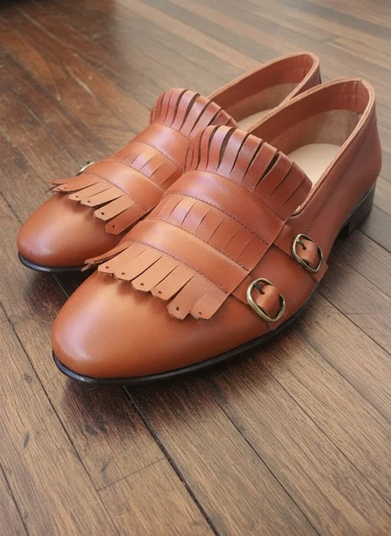 Brown leather loafers with fringe details