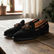 Black loafers with tassels