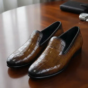 Brown crocodile-patterned loafers
