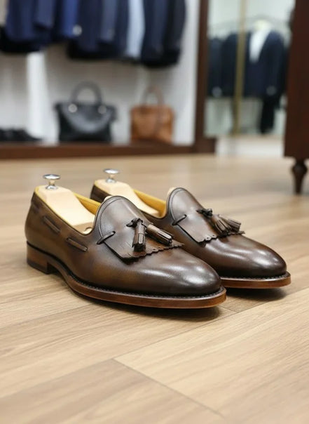 Brown leather loafers with tassels