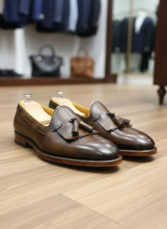 Brown leather loafers with tassels