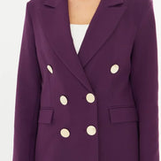 Purple suit with gold buttons on