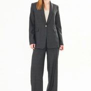Woman wearing a gray suit