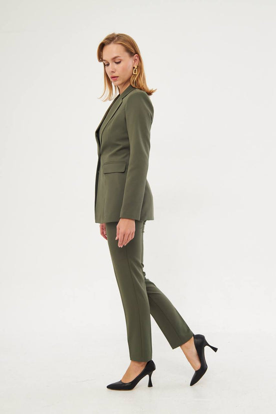 Woman wearing a green suit
