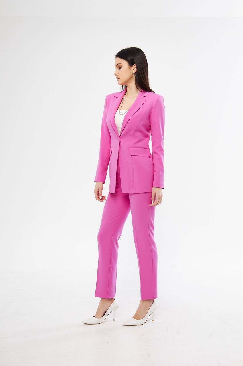 Woman wearing a bright pink suit 