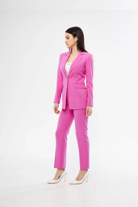 Woman wearing a bright pink suit 