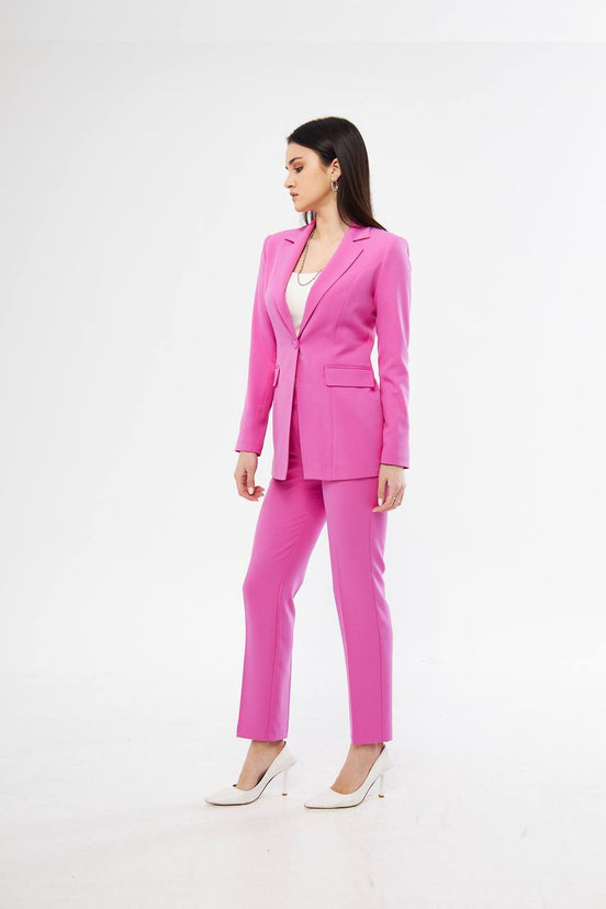 Woman wearing a bright pink suit 