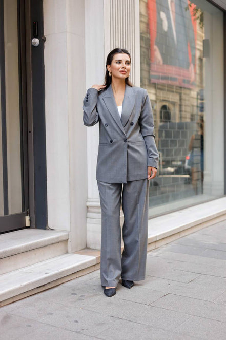 Woman in a gray suit