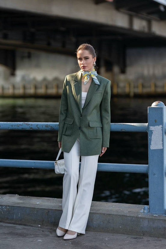 Woman in a green blazer