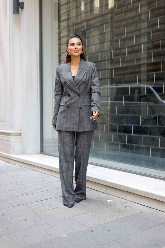 Woman in a gray suit