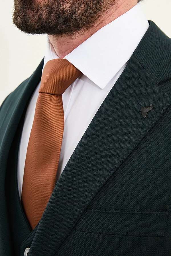 Man wearing a dark green suit