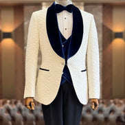 White dinner jacket with blue velvet lapels and navy blue vest and black pants