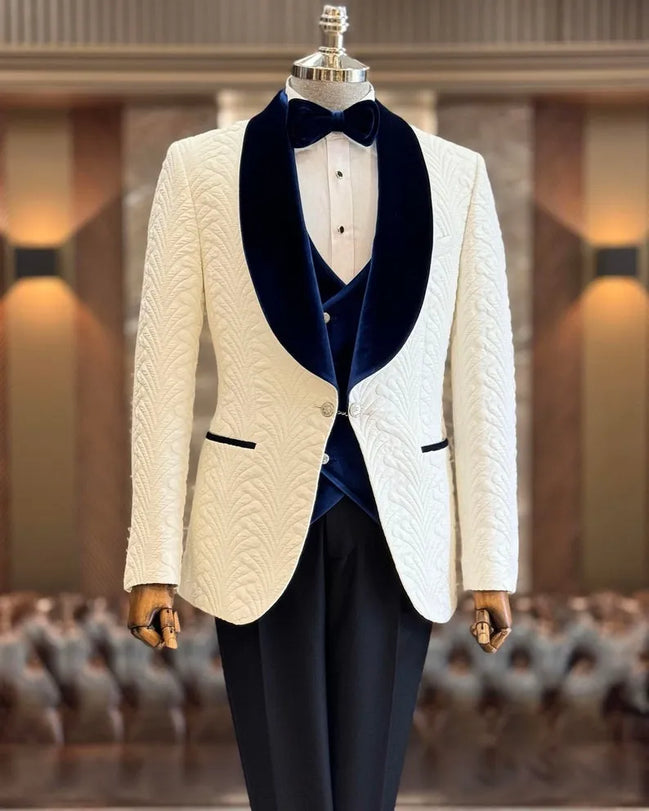 White dinner jacket with blue velvet lapels and navy blue vest and black pants