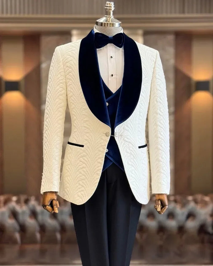White dinner jacket with blue velvet lapels and navy blue vest and black pants
