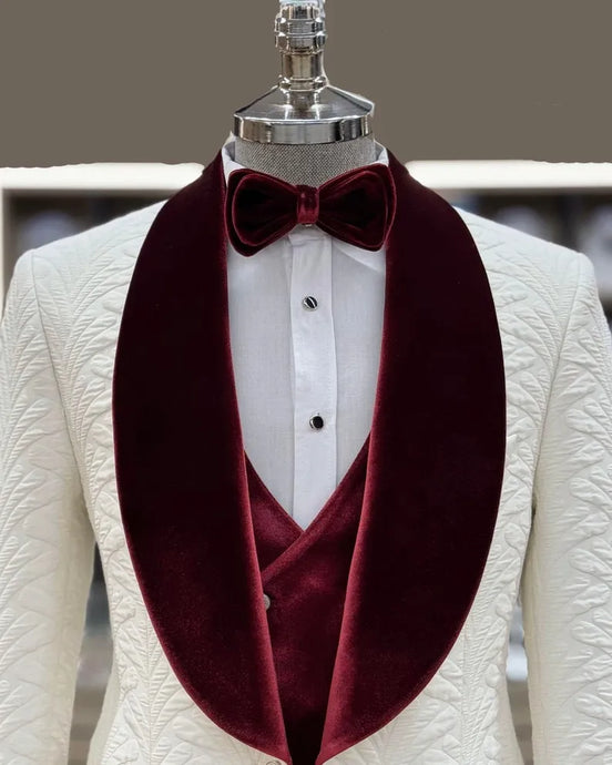 White suit jacket with burgundy velvet lapels and a matching bow tie