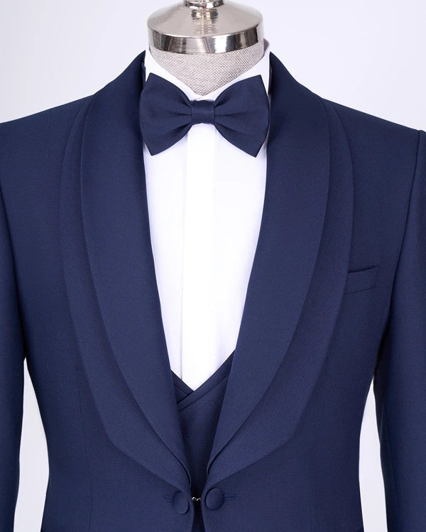 Navy blue tuxedo with a bow tie