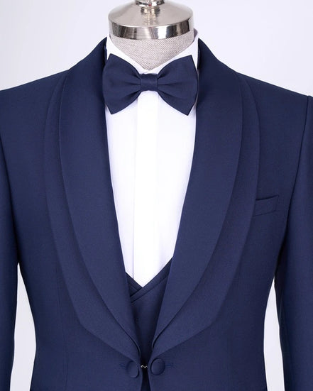 Navy blue tuxedo with a bow tie