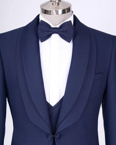 Navy blue tuxedo with a bow tie
