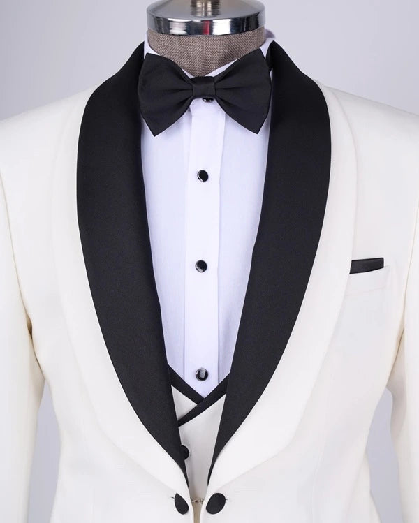 White tuxedo with black lapels and bow tie