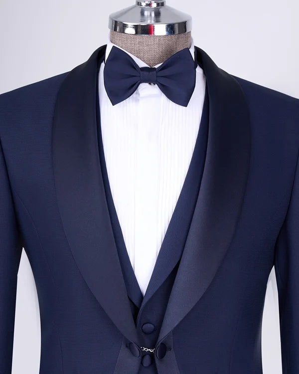 Navy blue tuxedo with a bow tie