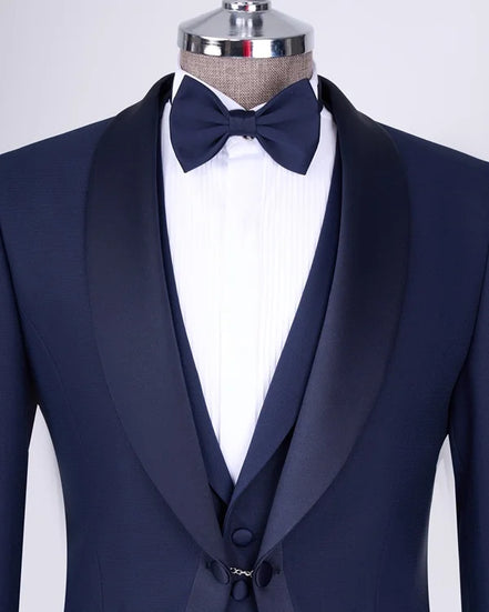 Navy blue tuxedo with a bow tie
