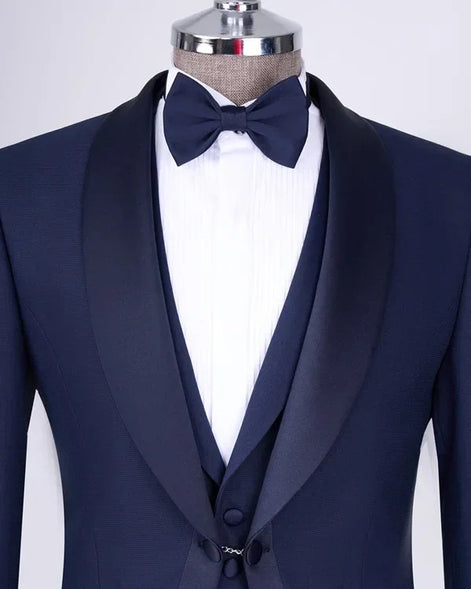 Navy blue tuxedo with a bow tie