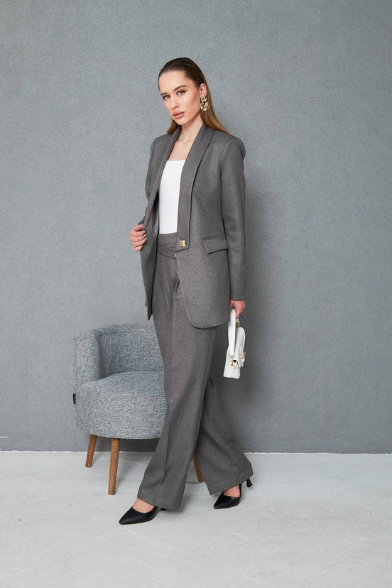Woman in a gray suit