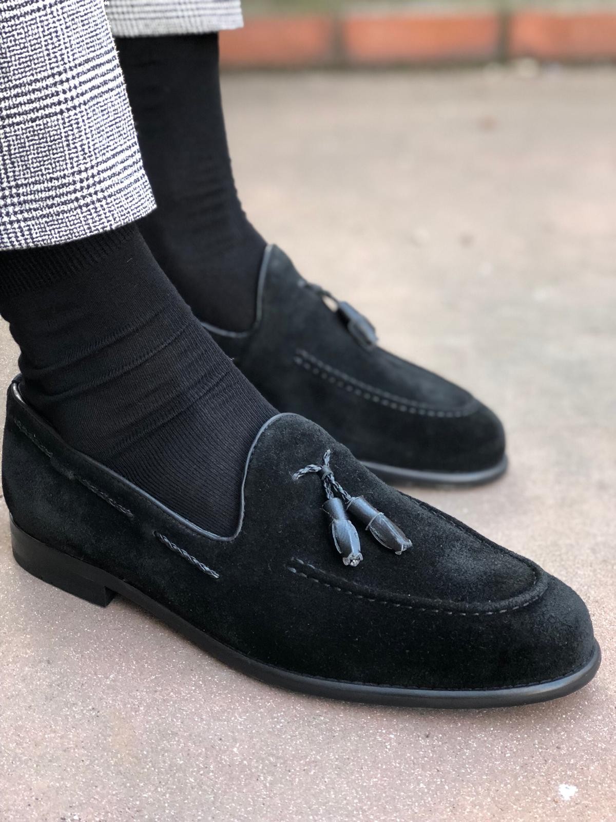 black loafers with tassels