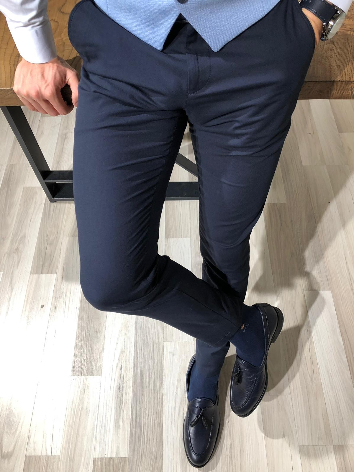 navy blue pants and black shoes