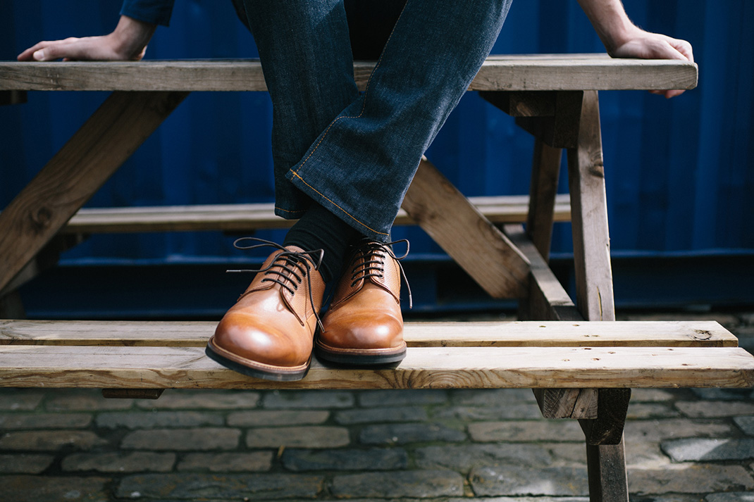 Black suit with brown belt and shoe