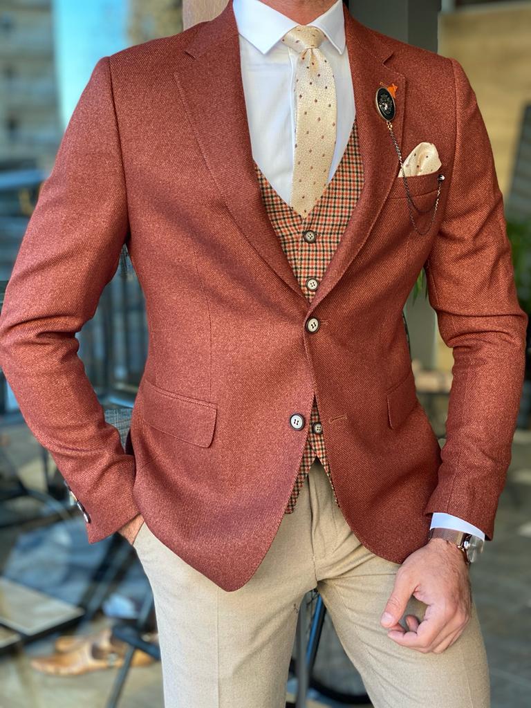 What color suit would go best with copper/rust dresses? I really don't like  tan suits and I want to stay away from rich colors (i.e. black). I've seen  a browny-grey tweed suit