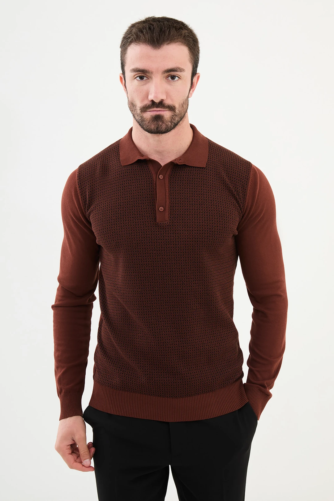 man in rust brown patterned polo wool sweater